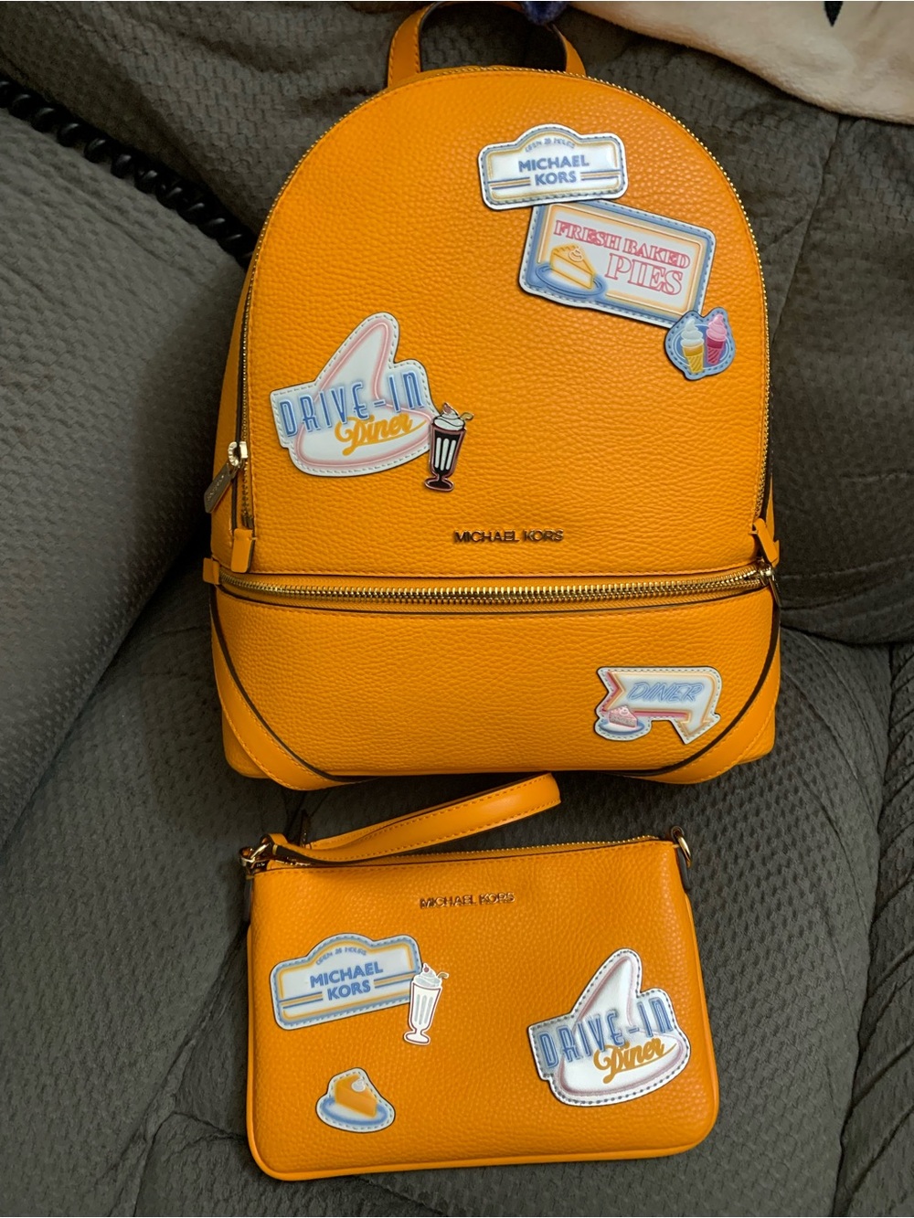 Michael Kors Bright Orange Pebbled Leather Backpack with Matching Wristlet